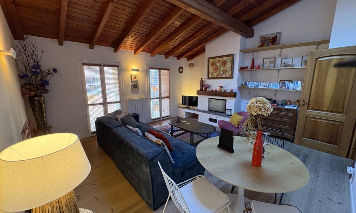 Arona Apartment | Luxury apartment in the heart of Arona, just steps from the lake and just 10 meters from Via Cavour, Arona's main shopping street with boutiques, restaurants, and shops for every need. This beautiful two-room apartment features wood and stoneware floors