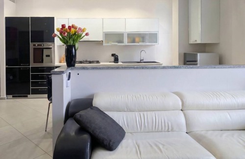 Monza Apartment | An elegant and welcoming 80-square-meter apartment, perfect for three people, located on the raised ground floor of an upscale building.The property is ideally situated for exploring the city: the Royal Villa of Monza is just a 10-minute walk away, while