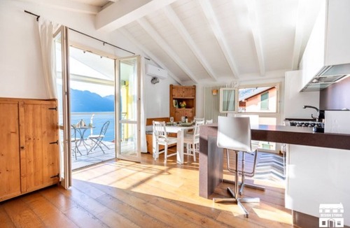 Olcio Apartment | Apartment located on the fourth floor (served by elevator from the garage) of a building facing the lake.The apartment enjoys a 180 degree view of the wonderful Lake Como.The position allows you to enjoy a unique view and feel like you are on the water's