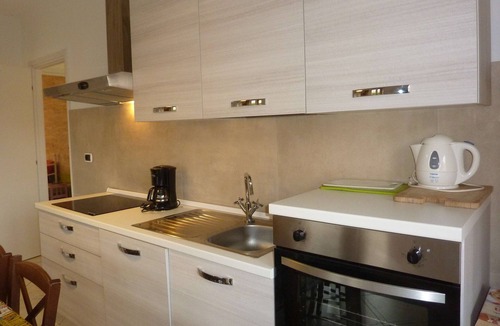 Porto Valtravaglia Apartment | Apartment 'Sunset On Lake Maggiore 2 Garages' with Garden, Balcony and Wi-Fi