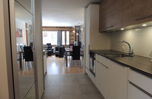 Grimentz Apartment | Comfortable 3 room apartment for 4-6 persons : Living room with Sofa-bed - swedish stove - kitchen w