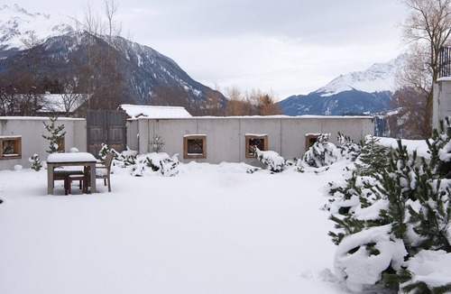 Grisons Apartment | Family oasis with garden and fireplace