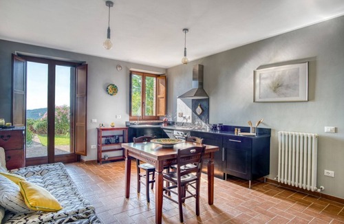 Fratticiola Selvatica Apartment | GuestHost - Elegant 57 sqm apartment in a renovated farmhouse, nestled in the Umbrian countryside. Ideal for 3 people, it offers a shared saltwater pool and an uncovered parking space. Perfect for those seeking relaxation and tranquility, surrounded by b