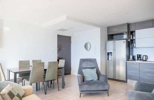 Perledo Apartment | In a panoramic position, modern apartment on the first floor of a new residence with SPA. Large windows frame the unique landscape of Lake COMO.This apartment has a beautiful terrace, with table and chairs and a sofa. The living room is a large open spac