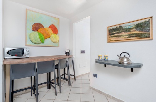 San Teodoro Apartment | Panoramic Holiday Apartment "Isuledda" with Sea View, Shared Pool & Air Conditioning