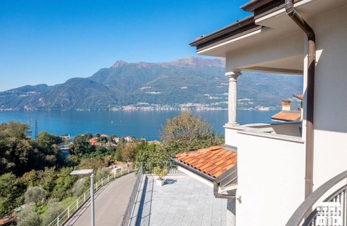 Bellano Apartment | Your Lake Como adventure begins here. Every sunset from the terrace, every laugh shared in the outdoor dining area, every hike on the surrounding trails will become part of your personal story. This air-conditioned apartment features two bedrooms with a