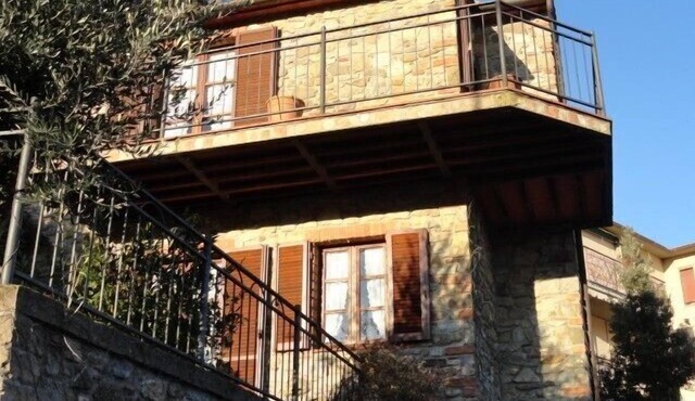 Beautiful stone house in Tuscany with terrace and balcony.