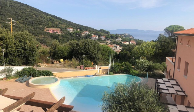 Pet-friendly Vacation Apartment La Pergola al Cavo 107 with Mountain View, Pool & Terrace