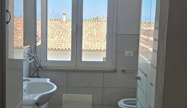 Relaxation one step away from Gardaland spas and beaches. in Lazise