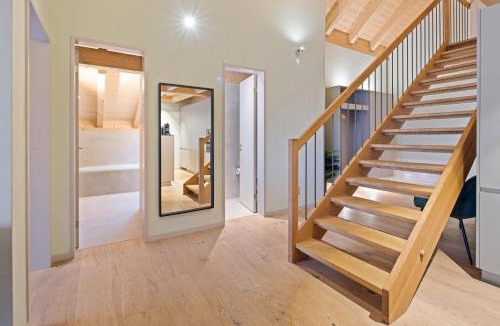 Bassersdorf Apartment | Visionary Hospitality Bassersdorf, Zürich - Premium Apartments in Swiss Style with Free Parking, Washer, Kitchen, Terrace, Vaulted Cellar Event Room, Bus Stop, 15' City & Airport