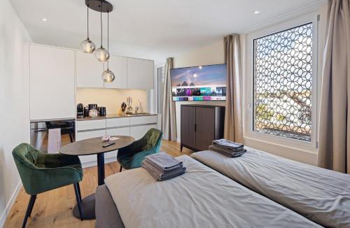 Embrach Apartment | Visionary Hospitality Embrach, Zürich - Premium Apartments with Free Parking, Washer, Kitchen, Rooftop Terrace, Lounge, Bus Stop, Train Station, 15' Airport